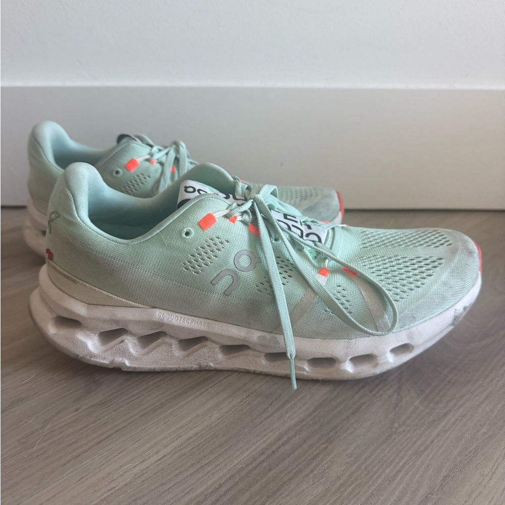 On Running Mint Green Shoes with White and Orange Accents